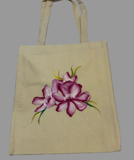 Beige tote bag with a pink floral design on a white background